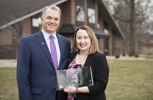 David Findlay presents Holly Davis with President and CEO Commitment Award. 